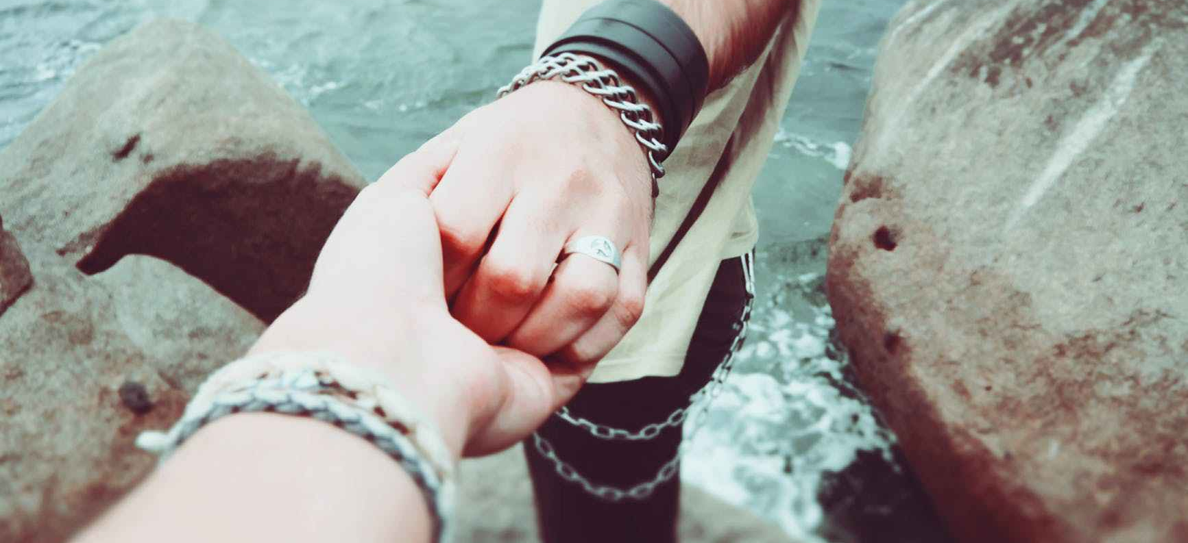 couple holding hands love people