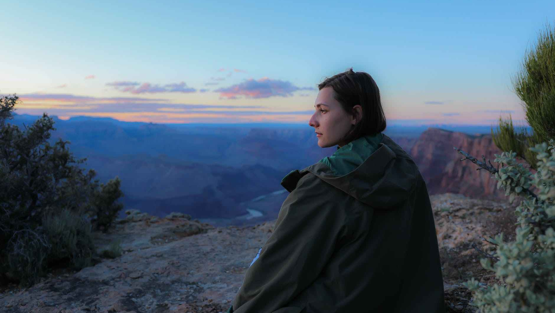 woman wearing brown jacket