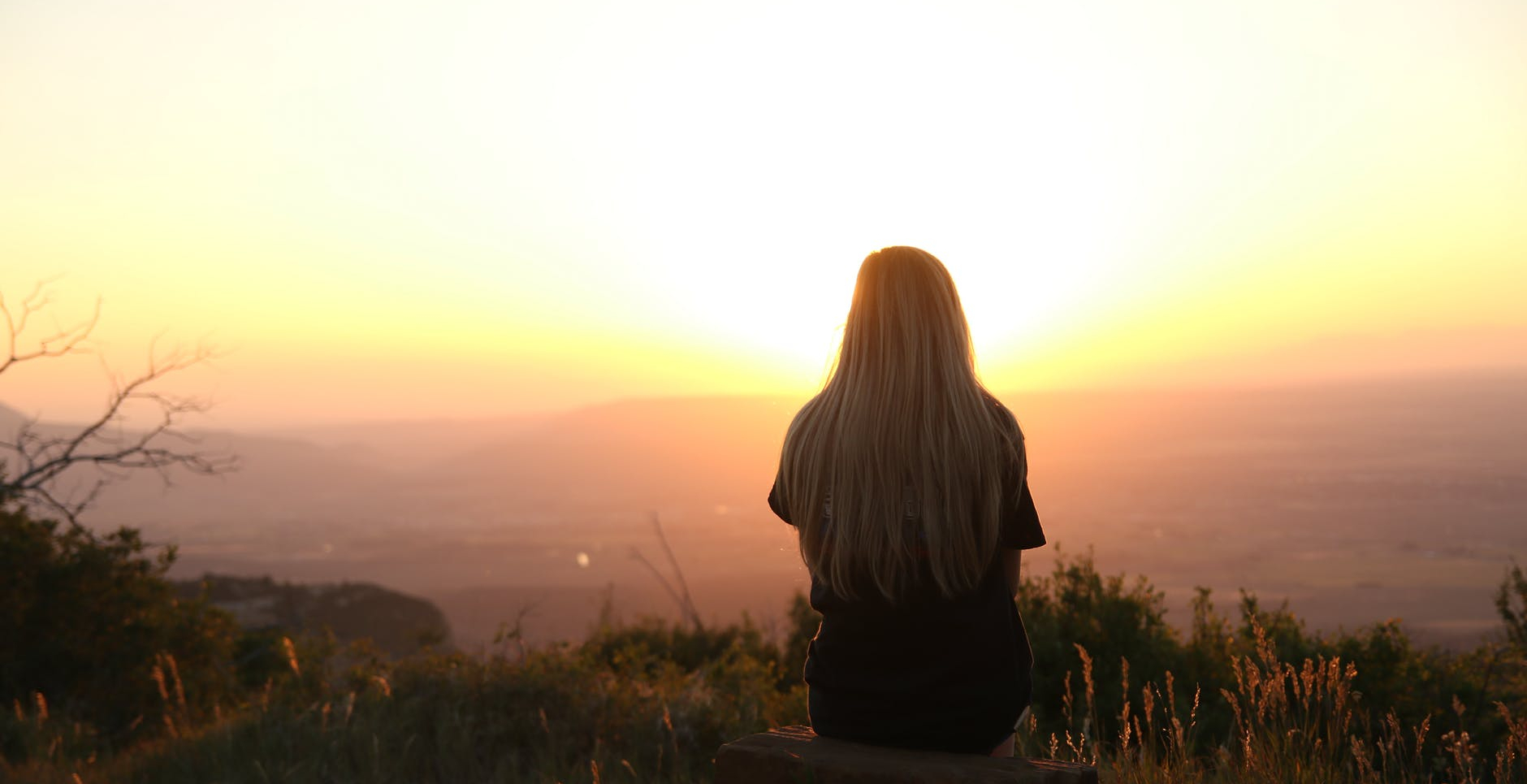 woman looking at sunset